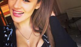Cute girl  with big tits is smiling