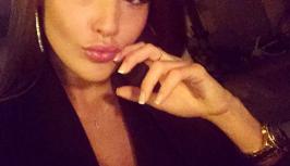 Sexy girl in black jacket on videochat