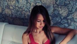 Girl in sexy red dress with big boobs is online