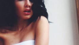 Girl in white towel looks sexy