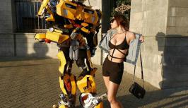 Sexy girl with big boobs stay at robot