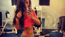 Girl in fitness gym has very hot body