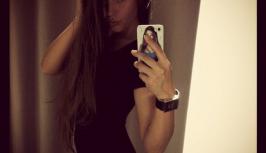 Girl in little black dress is very hot
