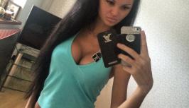 Sexy girl in short shorts has big boobs