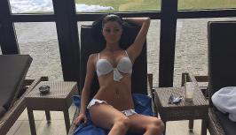 She lies in a swimsuit and wait for you
