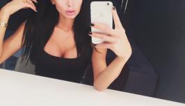 Girl in sexy black dress looks very hot