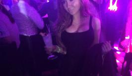 Hot girl in sexy black dress on the party